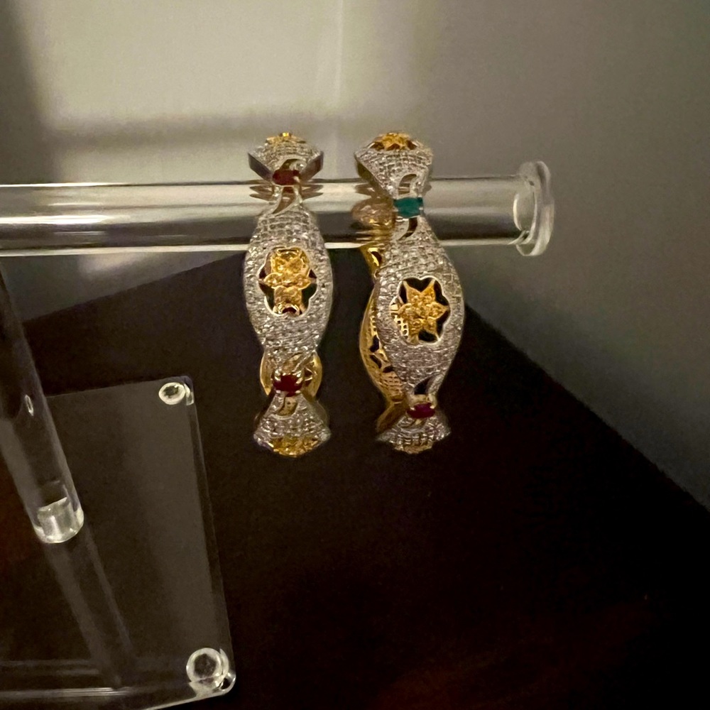 Elegant Gold and Silver Star-Embellished Bangles real emeralds and garnets.